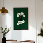 Framed artwork on a wall above a dining table with chairs.