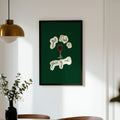 Framed artwork on a wall above a dining table with chairs.