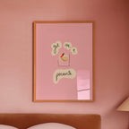 Pink bedroom with framed artwork 'get me a picante' on the wall and a lamp on a nightstand.