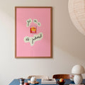 Dining room with a blue table, pink framed poster saying get me an old-fashioned, and pendant light.