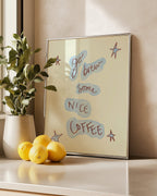 Framed artwork with text 'go brew some nice coffee' on a shelf with lemons and a plant.