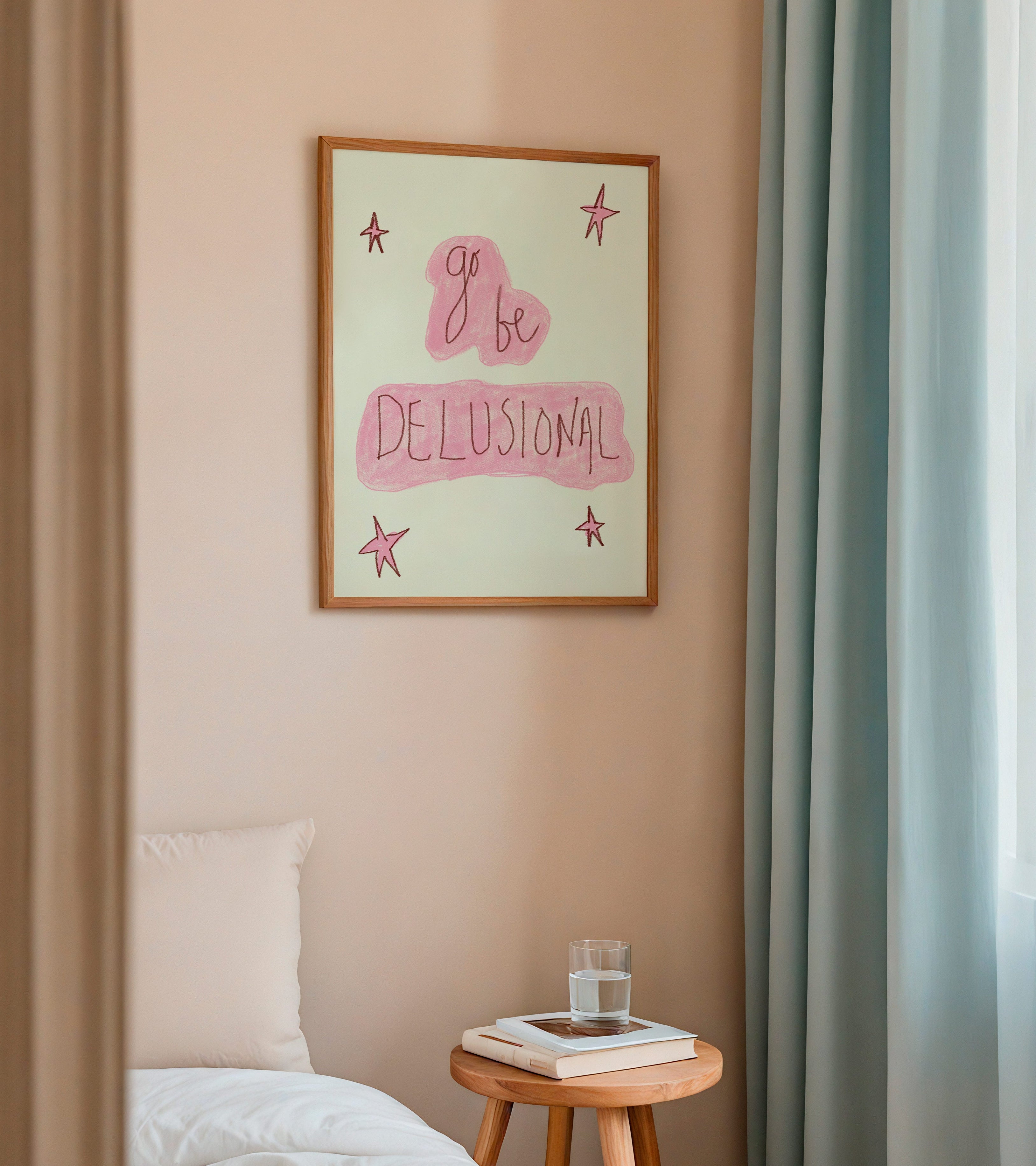 Room interior with a framed quote on the wall, a bed, and a small table with a glass of water.