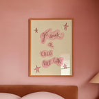 Bedroom with pink walls, a bed, and a lamp on a nightstand.