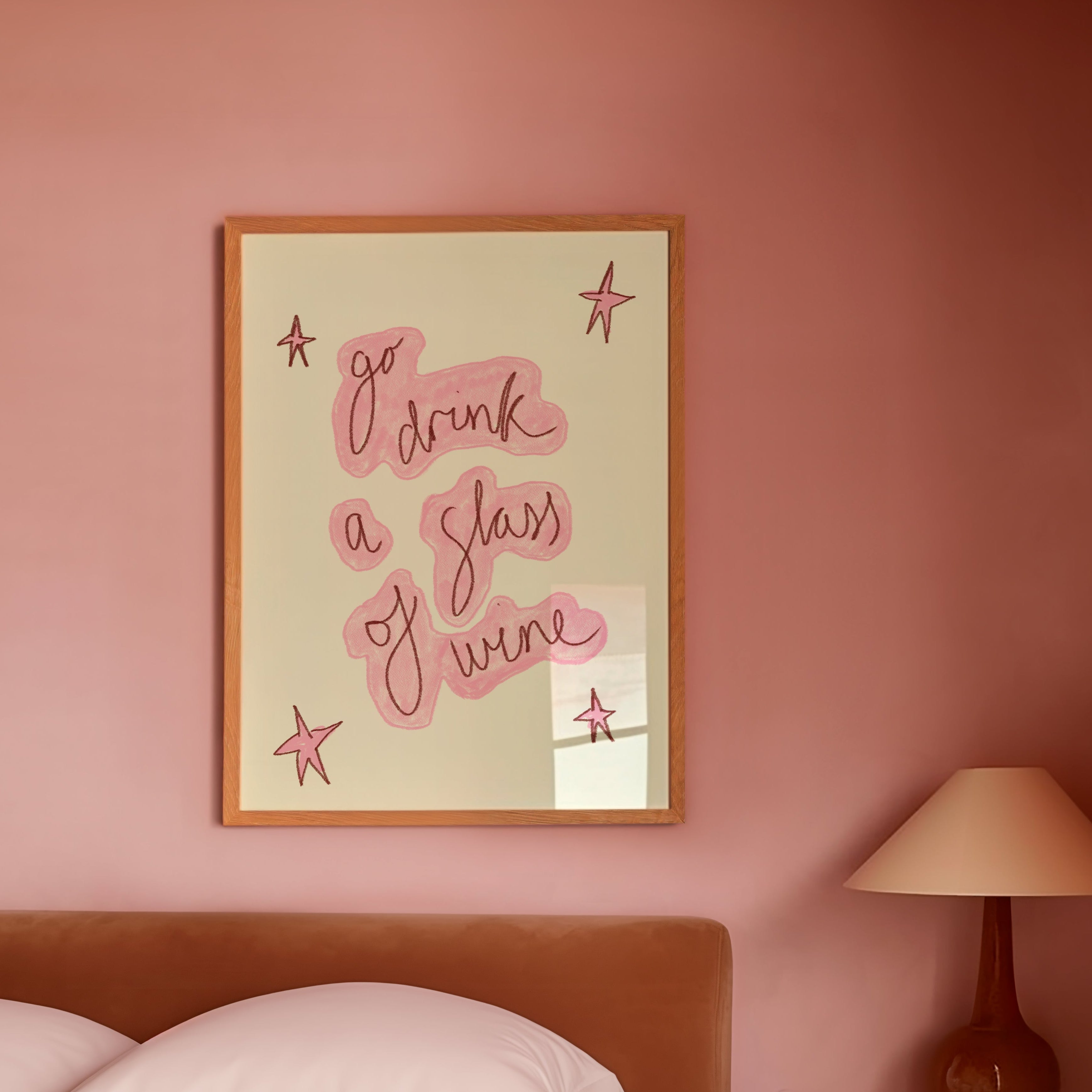 Bedroom with pink walls, a bed, and a framed quote on the wall.
