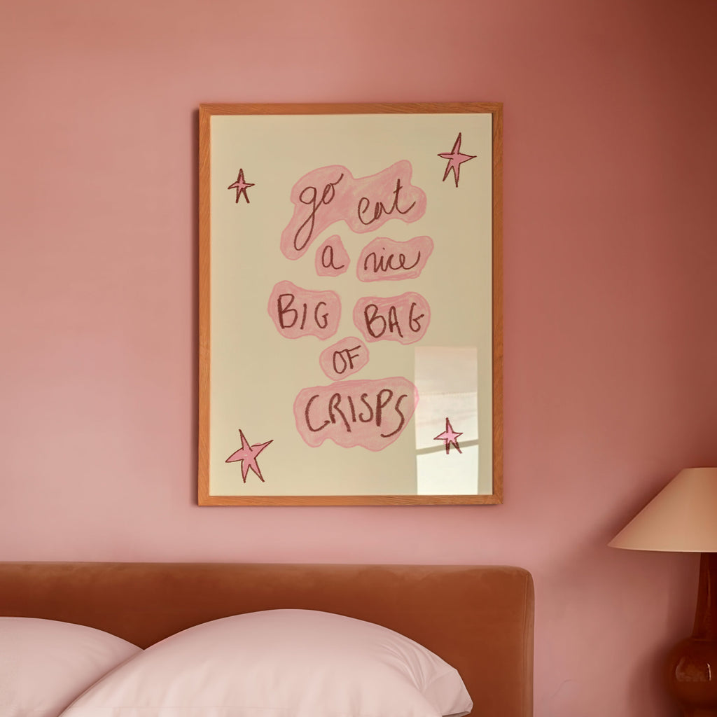Bedroom with pink walls, a bed, and a lamp on a nightstand.