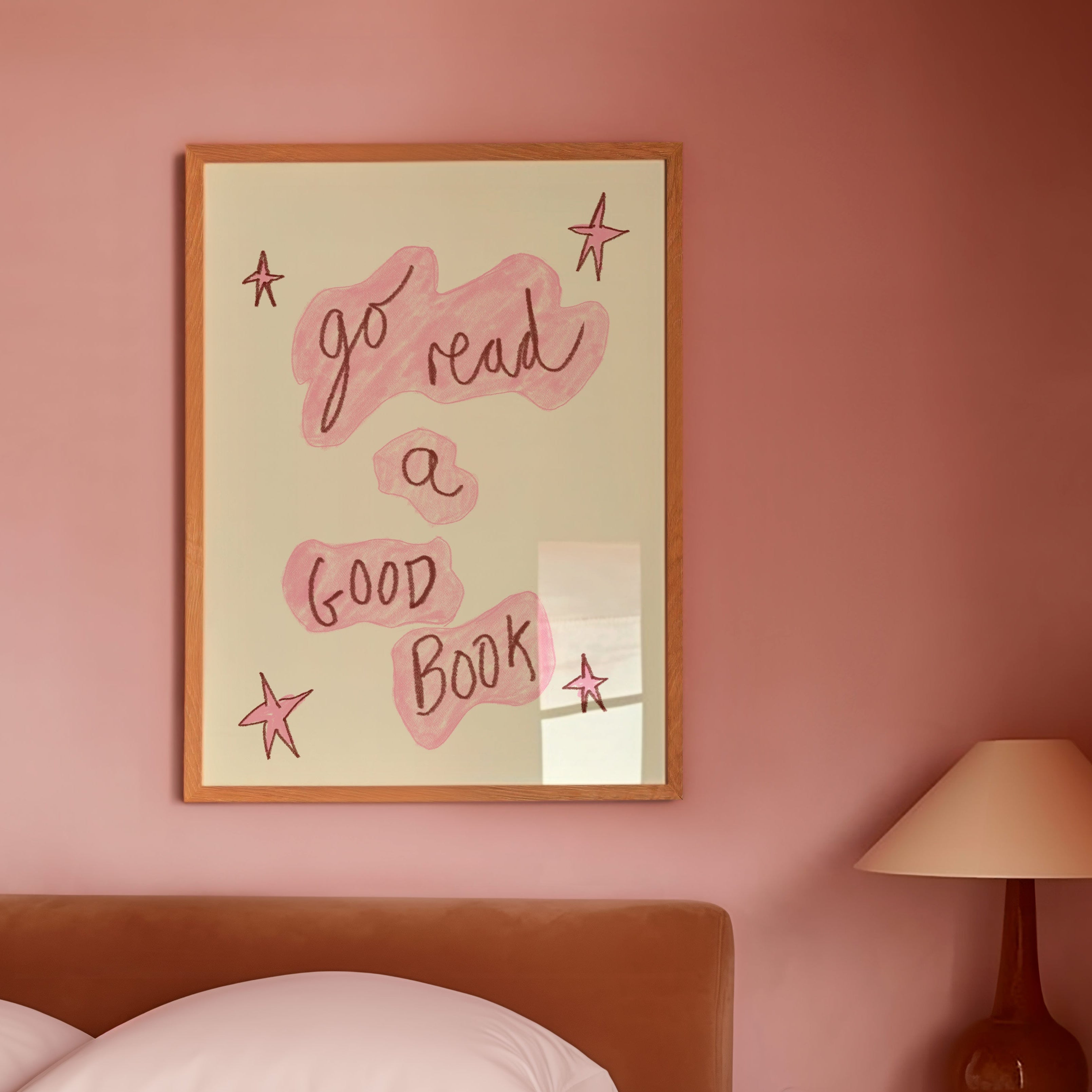 Bedroom with pink walls, a bed, and a framed quote on the wall.