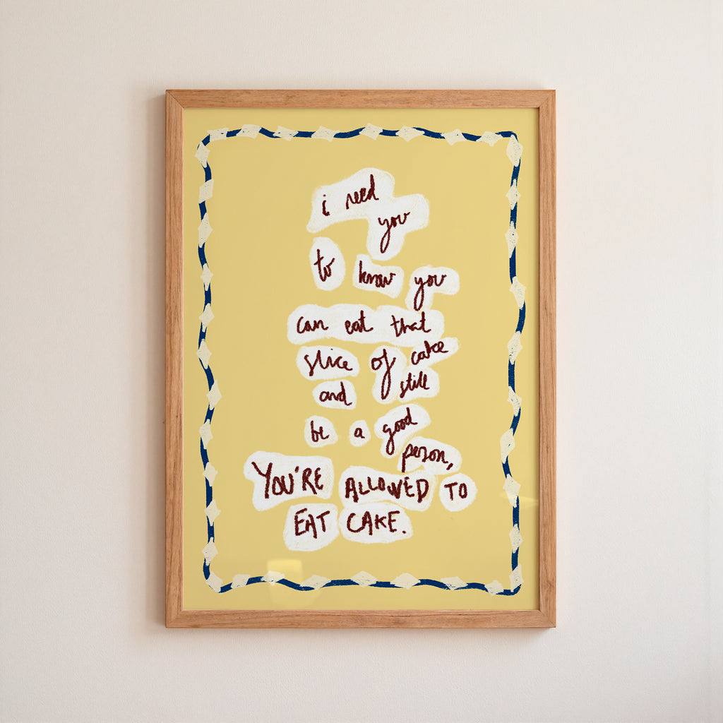 Yellow 'eat cake' Framed artwork with motivational quote on a yellow background