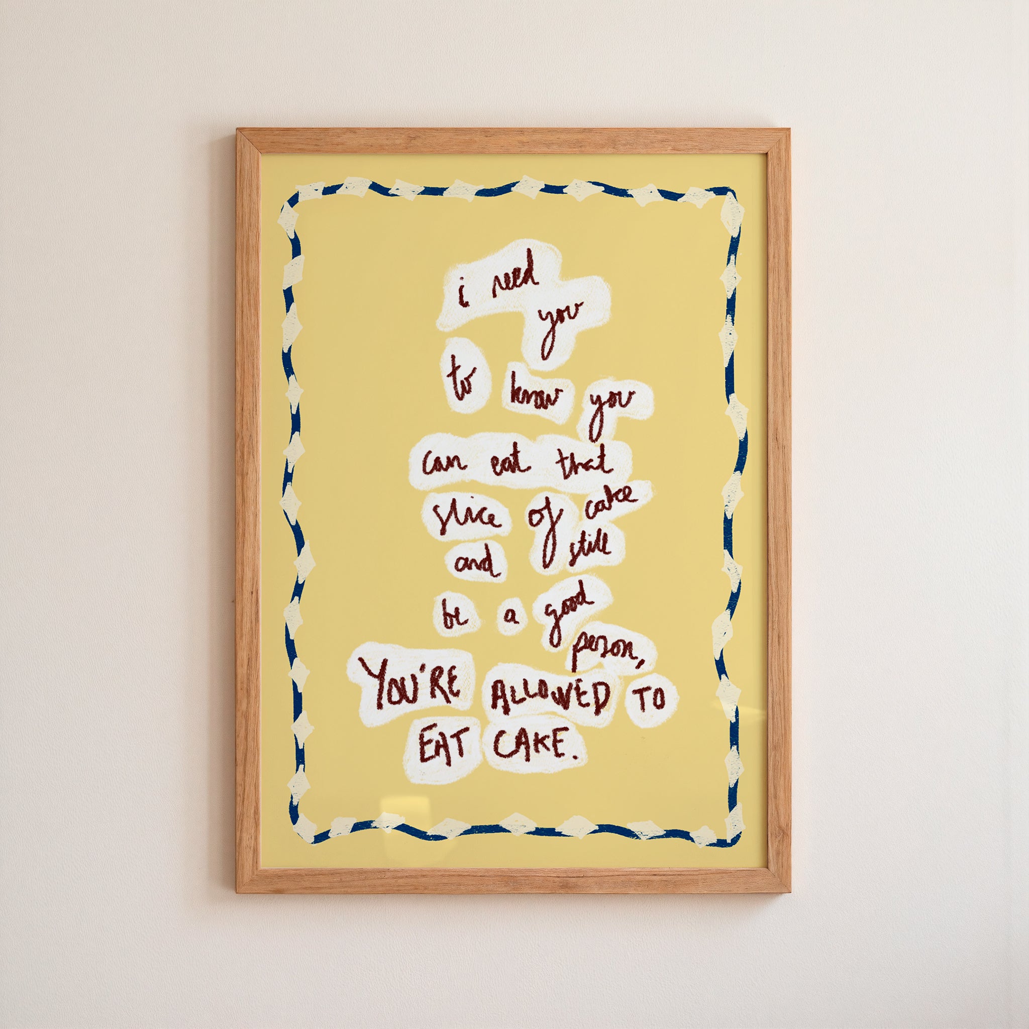 Yellow 'eat cake' Framed artwork with motivational quote on a yellow background