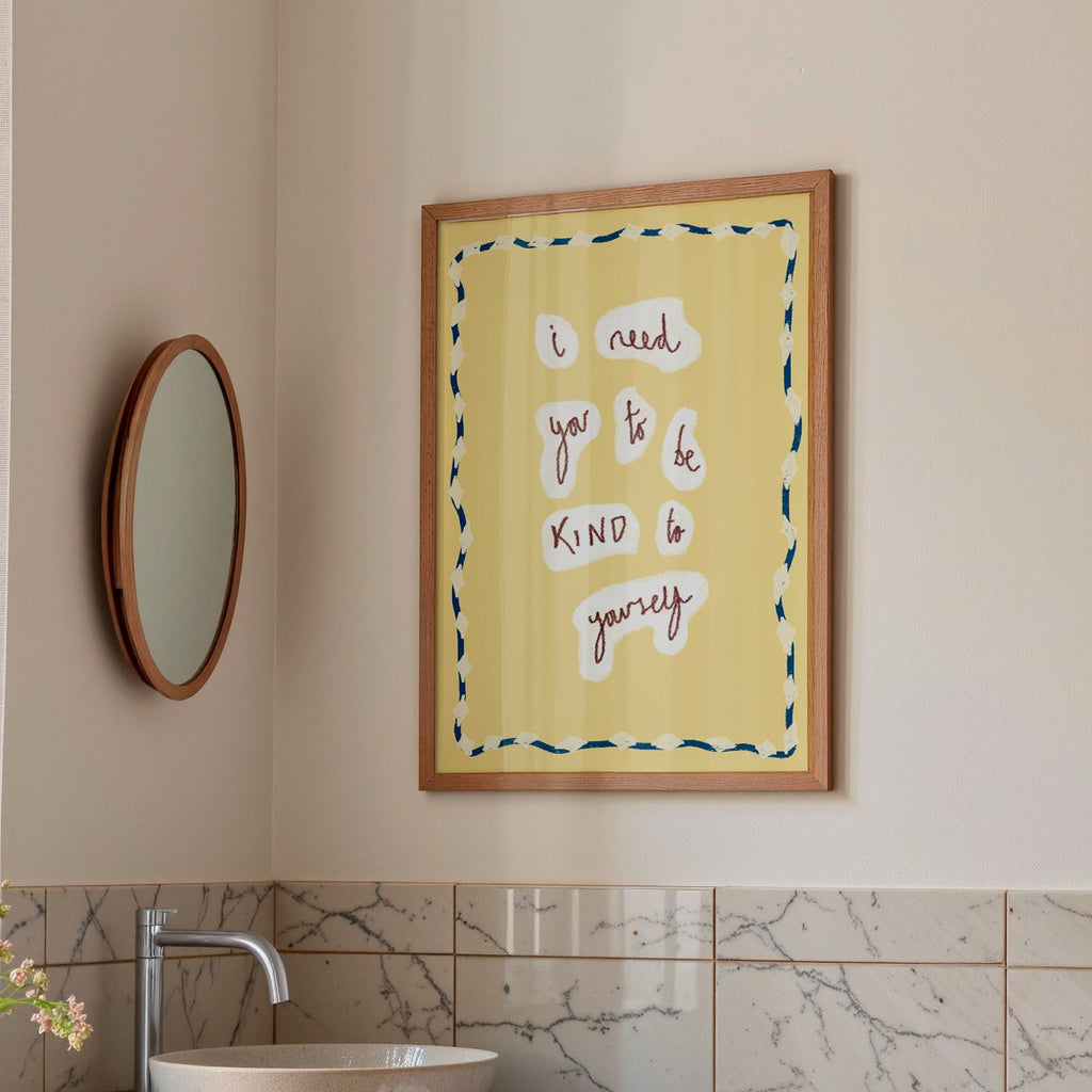 Bathroom interior with a sink, mirror, and framed artwork on the wall.