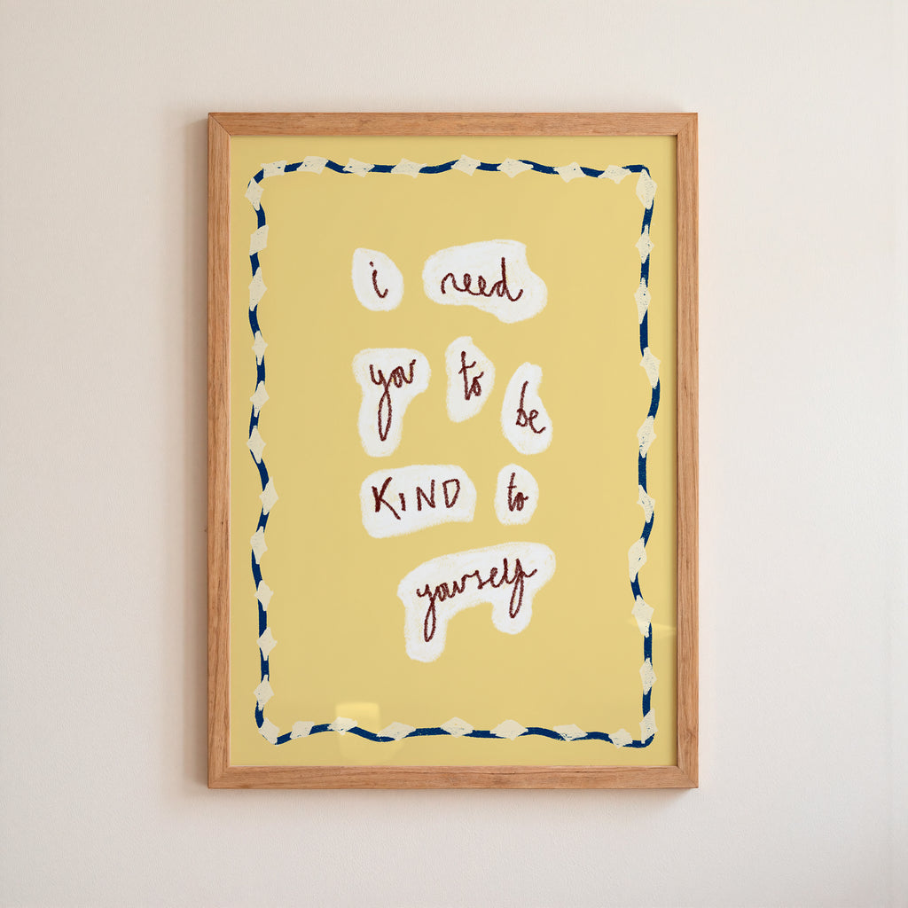 Framed artwork with motivational quote on a yellow background