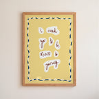 Framed artwork with motivational quote on a yellow background