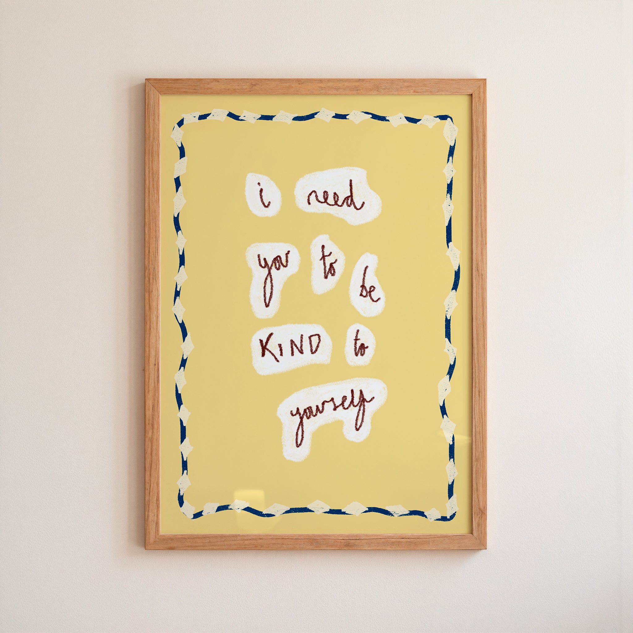 Framed artwork with motivational quote on a yellow background