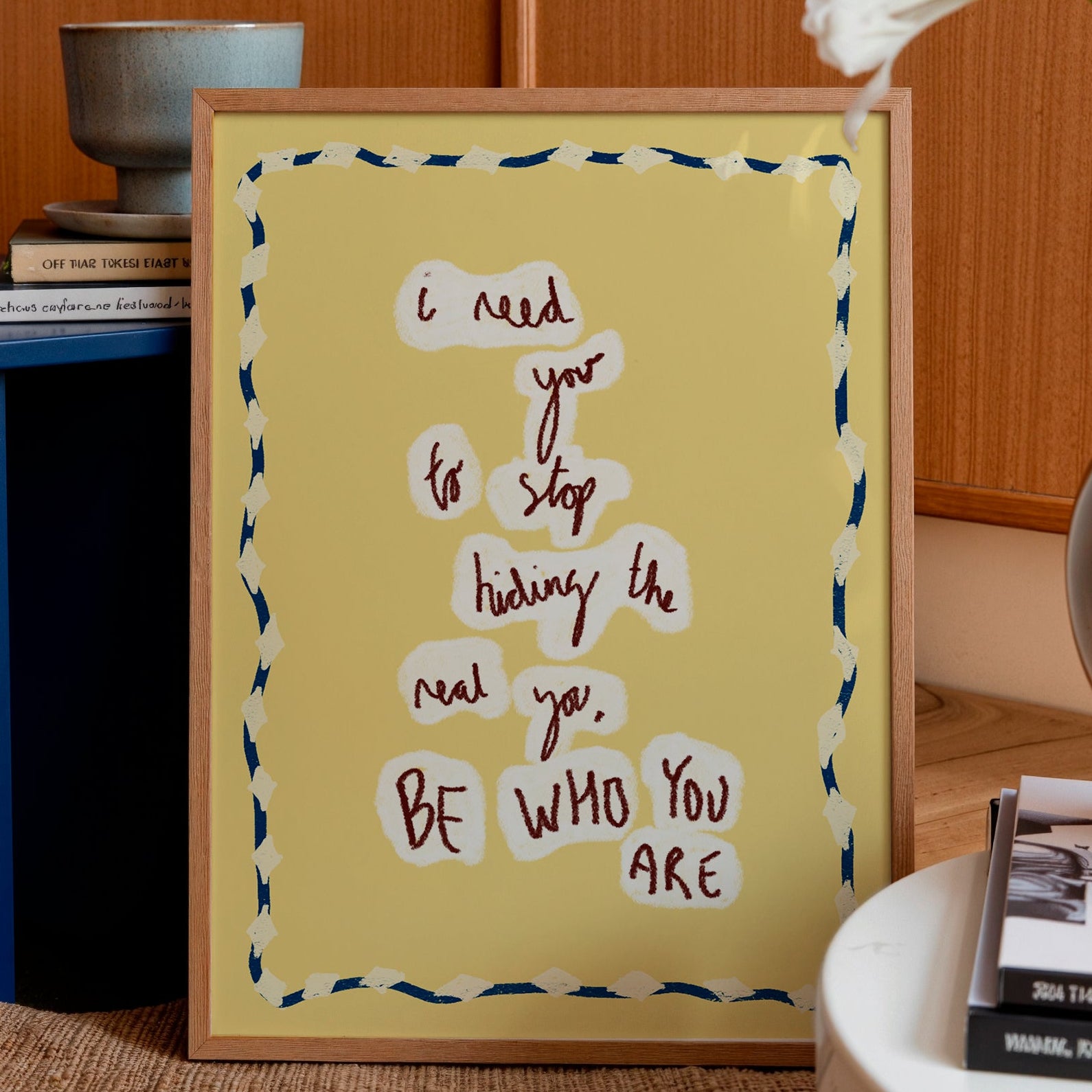 Yellow motivational print to be who you are in a frame in a living room setting