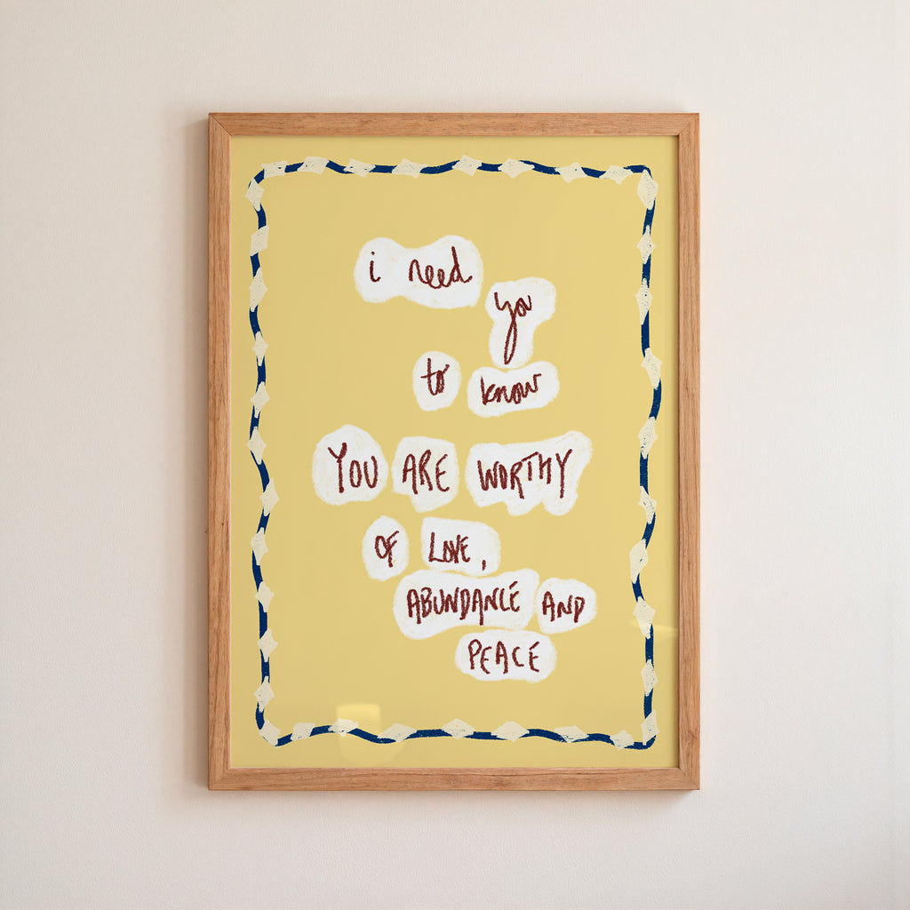 Framed motivational quote on a yellow background