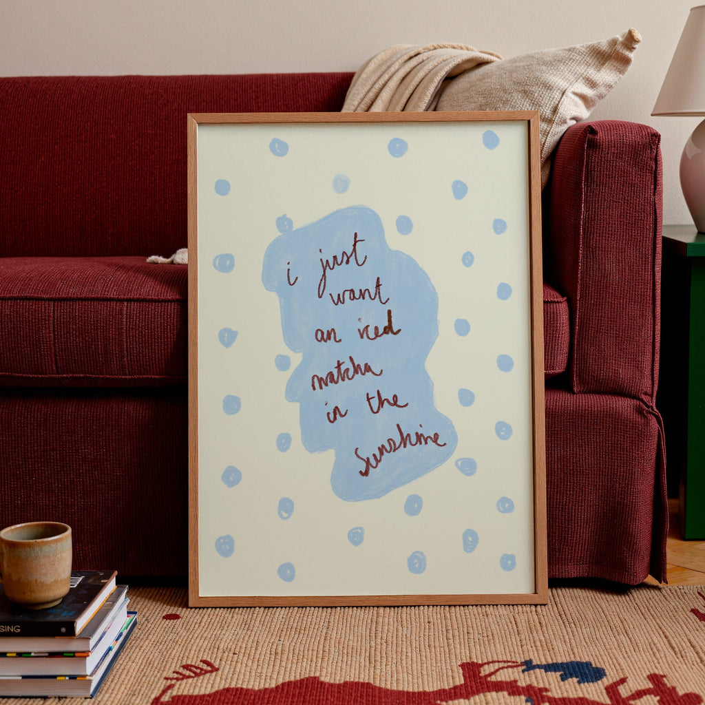 Framed artwork with text in a living room setting