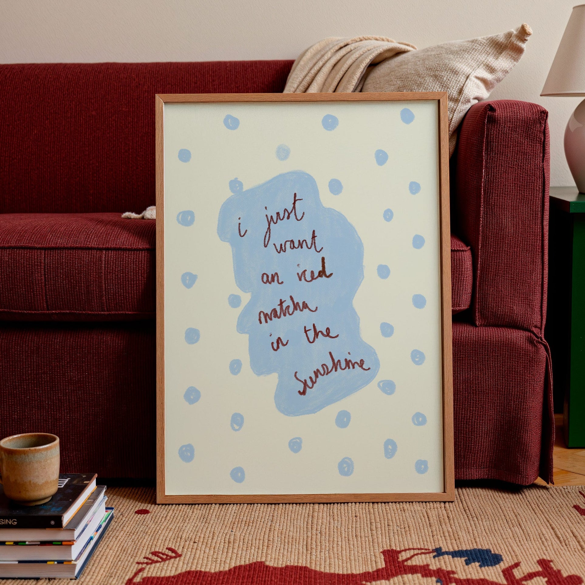 Framed artwork with text in a living room setting