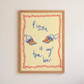 Framed artwork with a drawing of a pizza and text on a beige background